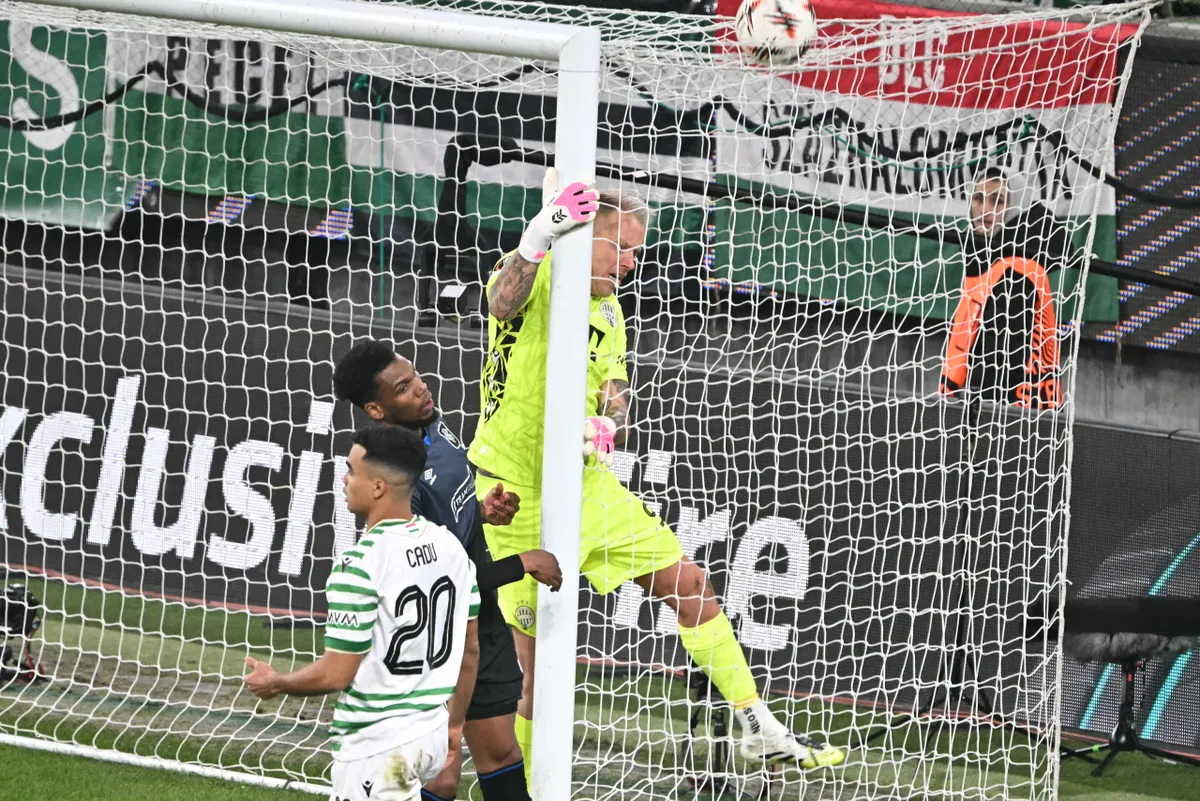 Ferencvaros' Hungarian defender #21 Endre Botka (C) and Ferencvaros' Hungarian goalkeeper #99 David Grof vie for the ball during the UEFA Europa League football match between Ferencvarosi TC and Rangers in Budapest on December 11, 2025. (Photo by Attila KISBENEDEK / AFP)