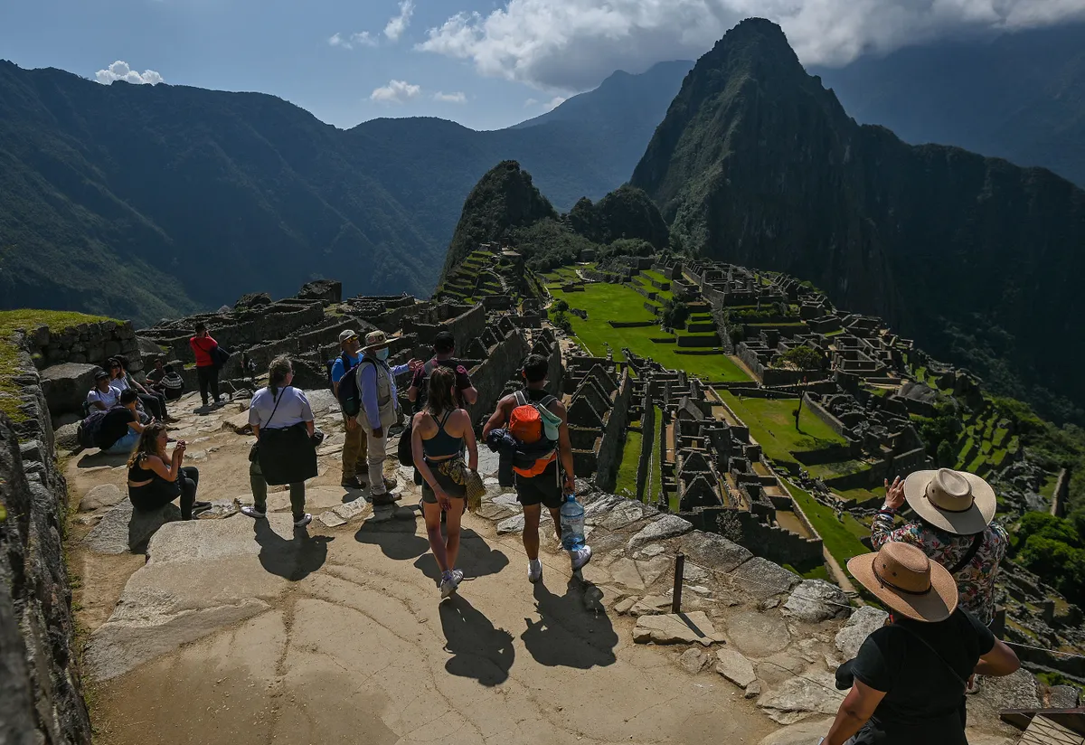 Tourists explore the ancient Inca city of Machu Picchu located in the Andes at an altitude of 2,430 meters (7,970 feet).
The most famous icon of the Inca civilization was declared a Peruvian Historical Sanctuary in 1981, a UNESCO World Heritage Site in 1983, and in 2007 was then declared one of the Seven New Wonders of the World.
On Wednesday, 20 April 2022, in Historic Sanctuary of Machu Picchu, Urubamba Province, Peru. (Photo by Artur Widak/NurPhoto) (Photo by Artur Widak / NurPhoto via AFP)