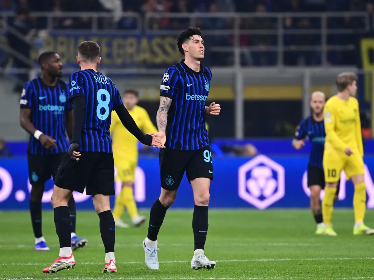 Inter Milan's Italian defender #95 Alessandro Bastoni (R) celebrates scoring his team's first goal during the UEFA Champions League second-leg play-off football match between Inter Milan and Bodo/Glimt at San Siro stadium in Milan, northern Italy, on February 24, 2026. (Photo by PIERO CRUCIATTI / AFP)