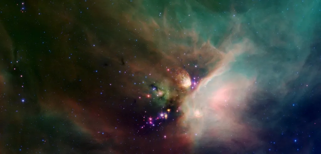 Newborn stars peek out from beneath their natal blanket of dust in this dynamic image of the Rho Ophiuchi dark cloud from the Spitzer Space Telescope. Located near the constellations Scorpius and Ophiuchus, the nebula is about 407 light years away from Earth. Rho Oph is a complex made up of a large main cloud of molecular hydrogen, a key molecule allowing new stars to form from cold cosmic gas, with two long streamers trailing off in different directions. This false-color image of Rho Oph's main cloud, Lynds 1688, was created with data from Spitzer's infrared array camera, which has the highest spatial resolution of Spitzer's three imaging instruments, and its multiband imaging photometer, best for detecting cooler materials. The multiple wavelengths reveal different aspects of the dust surrounding and between the embedded stars, yielding information about the stars and their birthplace. The colors in this image reflect the relative temperatures and evolutionary states of the various stars. The youngest stars are surrounded by dusty disks of gas from which they, and their potential planetary systems, are forming. These young disk systems show up as red in this image. Some of these young stellar objects are surrounded by their own compact nebulae. More evolved stars, which have shed their natal material, are blue. The extended white nebula in the center right of the image is a region of the cloud which is glowing in infrared light due to the heating of dust by bright young stars near the right edge of the cloud. Fainter multi-hued diffuse emission fills the image. The color of the nebulosity depends on the temperature, composition and size of the dust grains. Most of the stars forming now are concentrated in a filament of cold, dense gas that shows up as a dark cloud in the lower center and left side of the image against the bright background of the warm dust. (Photo by Stocktrek Images / StockTrek Images via AFP)