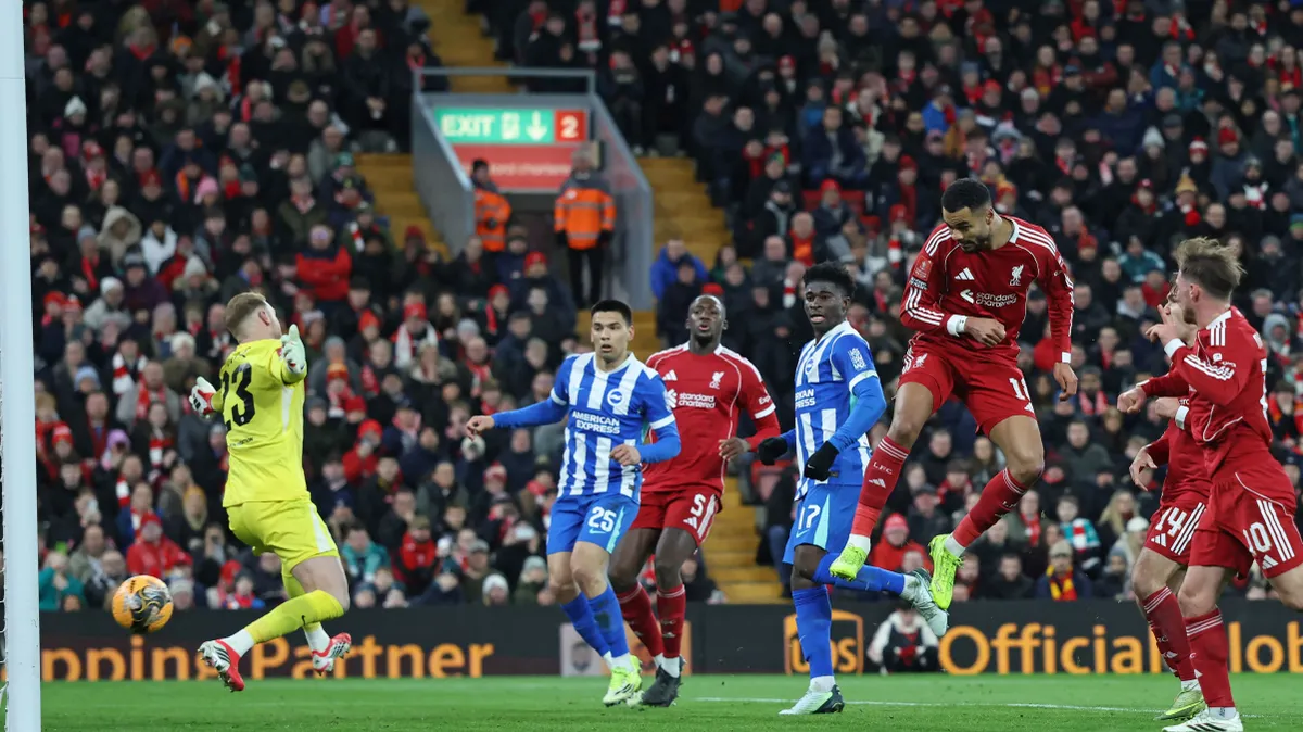 Liverpool's Dutch striker #18 Cody Gakpo (2R) scores, but from an offside position during the English FA Cup fourth round football match between Liverpool and Brighton and Hove Albion at Anfield in Liverpool, north west England on February 14, 2026. (Photo by Darren Staples / AFP) / RESTRICTED TO EDITORIAL USE. No use with unauthorized audio, video, data, fixture lists, club/league logos or 'live' services. Online in-match use limited to 120 images. An additional 40 images may be used in extra time. No video emulation. Social media in-match use limited to 120 images. An additional 40 images may be used in extra time. No use in betting publications, games or single club/league/player publications. /