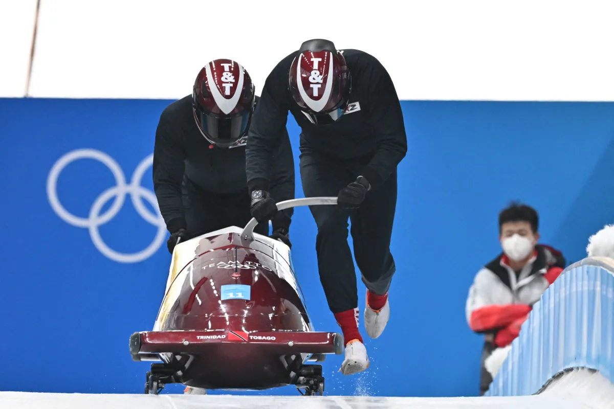 Trinidad and Tobago's Axel Brown takes part in the 2-man bobsleigh training at the Yanqing National Sliding Centre during the Beijing 2022 Winter Olympic Games in Yanqing on February 10, 2022. (Photo by Joe KLAMAR / AFP)