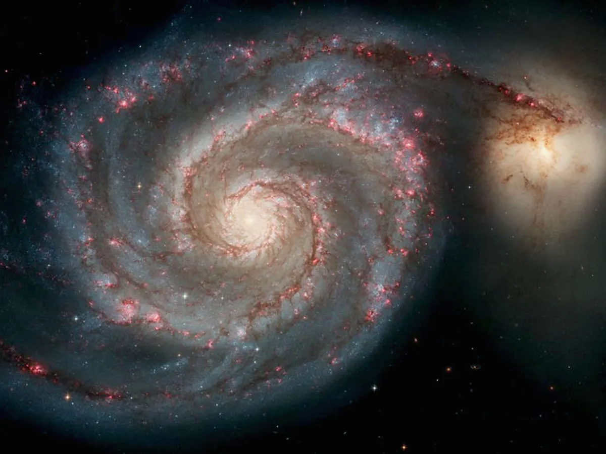 SPACE - APRIL 25: In this handout image released from the Hubble Space Telescope the Whirlpool Galaxy is seen , April 25, 2005 released for the Hubble 15th anniversary. Nasa's Space Telescope has obited the Earth for 15 years and has taken more than 700,000 images of the comos. This image is one of the sharpest images Hubble has ever produced, taken with the newest camera. (Photo by Hubble Space Telescope/Nasa via Getty Images)