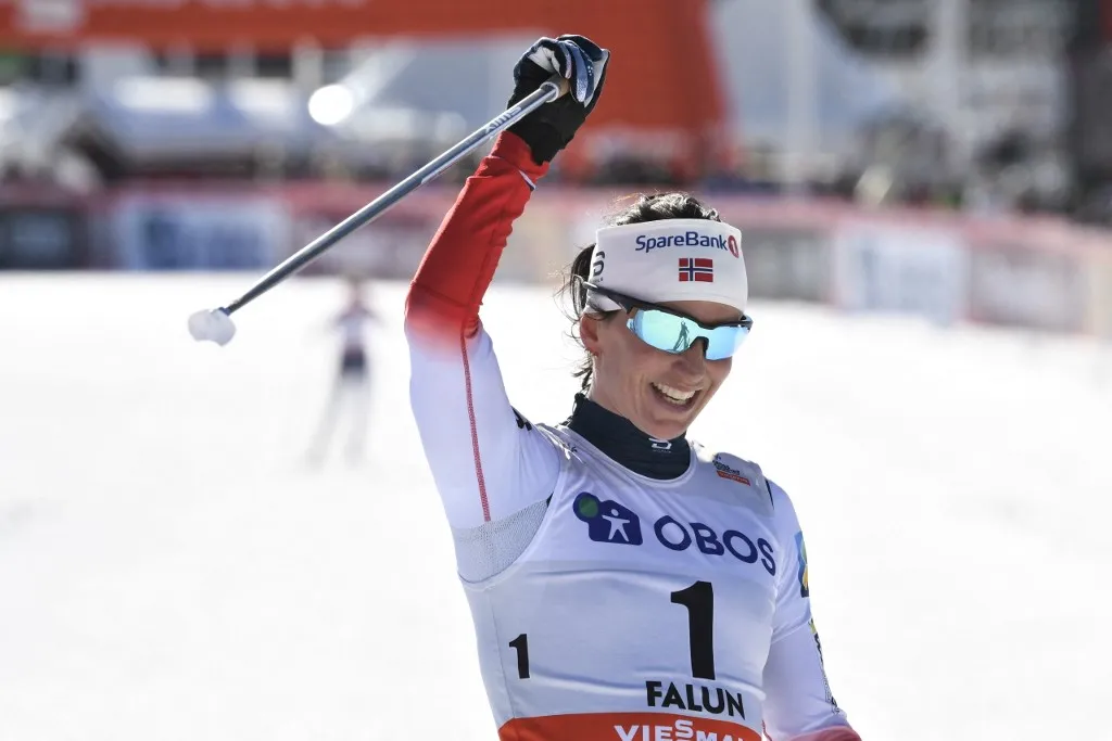 Norway's Marit Bjoergen celebrates after winning the FIS Cross-Country World Cup Women's 10 km Pursuit Free Style event on March 18, 2018 in Falun, Sweden. (Photo by Ulf PALM / TT News Agency / AFP) / Sweden OUT