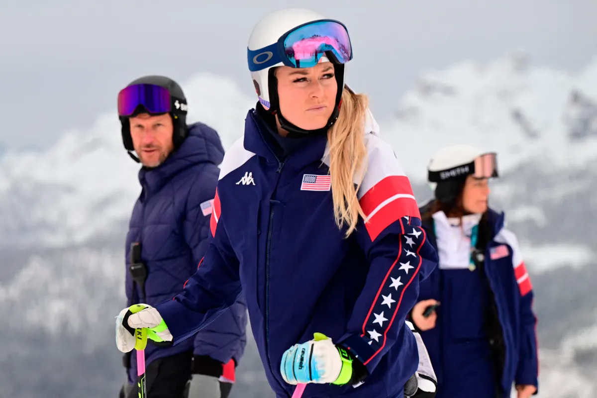 US' Lindsey Vonn inspects the slope with her coach Norway's former skier Aksel Lund Svindal before the second official training for the women's downhill event at the Tofane Alpine Skiing Centre during Milano Cortina 2026 Winter Olympic Games in Cortina dAmpezzo on February 6, 2026. (Photo by Stefano RELLANDINI / AFP)