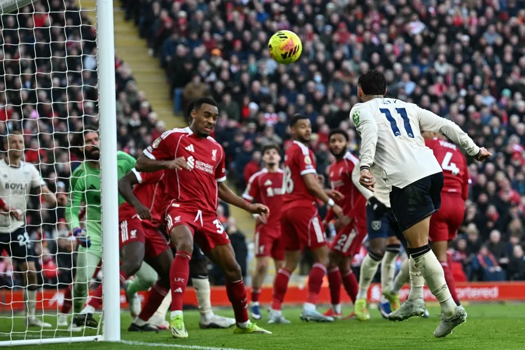 West Ham United's Argentinian striker #11 Taty Castellanos (R) heads in their second goal during the English Premier League football match between Liverpool and West Ham United at Anfield in Liverpool, north west England on February 28, 2026. (Photo by Paul ELLIS / AFP) / RESTRICTED TO EDITORIAL USE. No use with unauthorized audio, video, data, fixture lists, club/league logos or 'live' services. Online in-match use limited to 120 images. An additional 40 images may be used in extra time. No video emulation. Social media in-match use limited to 120 images. An additional 40 images may be used in extra time. No use in betting publications, games or single club/league/player publications. / 