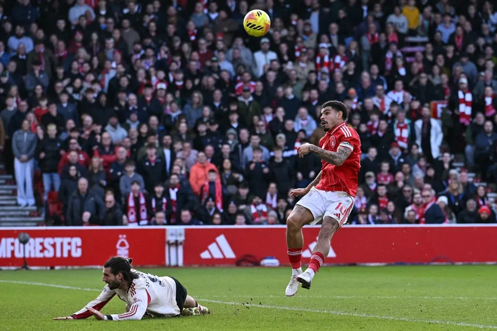 Nottingham Forest's English midfielder #10 Morgan Gibbs-White (R) has a shot rebound after his shot was defended by Liverpool's Hungarian midfielder #08 Dominik Szoboszlai (L) during the English Premier League football match between Nottingham Forest and Liverpool at The City Ground in Nottingham, central England on February 22, 2026. (Photo by Ben STANSALL / AFP) / RESTRICTED TO EDITORIAL USE. No use with unauthorized audio, video, data, fixture lists, club/league logos or 'live' services. Online in-match use limited to 120 images. An additional 40 images may be used in extra time. No video emulation. Social media in-match use limited to 120 images. An additional 40 images may be used in extra time. No use in betting publications, games or single club/league/player publications. / 