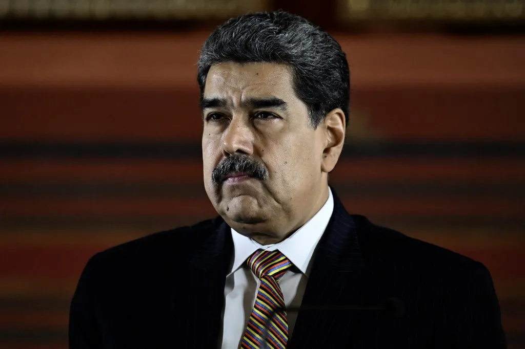 (FILES) Venezuela's President Nicolas Maduro looks on during a meeting at the National Assembly in Caracas on August 22, 2025. Argentine authorities requested on February 4, 2026, that the United States extradite ousted Venezuelan president Nicolas Maduro to be questioned in a case involving crimes against humanity, according to a court ruling seen by AFP. (Photo by Juan BARRETO / AFP)