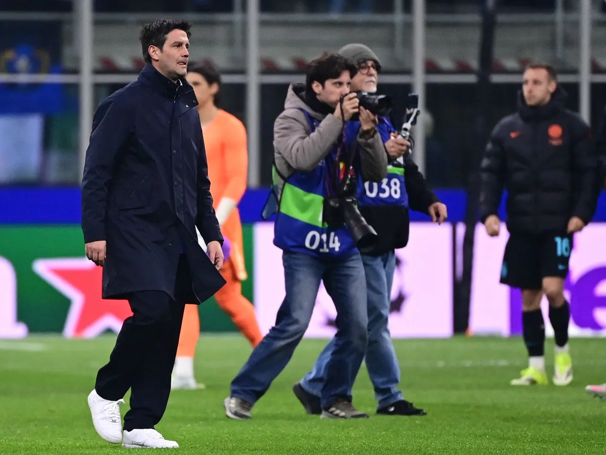 Inter Milan's Romanian coach Cristian Chivu (L) reacts at the end of the UEFA Champions League second-leg play-off football match between Inter Milan and Bodo/Glimt at San Siro stadium in Milan, northern Italy, on February 24, 2026. (Photo by PIERO CRUCIATTI / AFP)