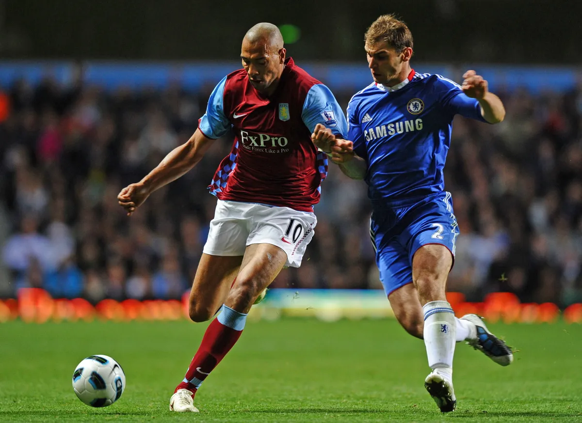 Aston Villa's Norwegian striker John Carew (L) vies with Chelsea's Serbian defender Branislav Ivanovic during the English Premier League football match between Aston Villa and Chelsea at Villa Park, Birmingham, West Midlands, England, on October 16, 2010. AFP PHOTO/PAUL ELLIS
FOR EDITORIAL USE ONLY Additional licence required for any commercial/promotional use or use on TV or internet (except identical online version of newspaper) of Premier League/Football League photos. Tel DataCo +44 207 2981656. Do not alter/modify photo. (Photo by PAUL ELLIS / AFP)
