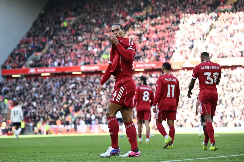 Liverpool's Dutch defender #04 Virgil van Dijk celebrates after scoring their second goal during the English Premier League football match between Liverpool and West Ham United at Anfield in Liverpool, north west England on February 28, 2026. (Photo by Paul ELLIS / AFP) / RESTRICTED TO EDITORIAL USE. No use with unauthorized audio, video, data, fixture lists, club/league logos or 'live' services. Online in-match use limited to 120 images. An additional 40 images may be used in extra time. No video emulation. Social media in-match use limited to 120 images. An additional 40 images may be used in extra time. No use in betting publications, games or single club/league/player publications. / 