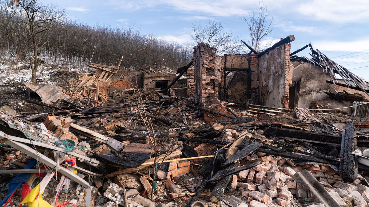 BOHODUKHIV, UKRAINE - FEBRUARY 11: Damaged buildings and debris are seen after a drone attack in the city of Bohodukhiv in the Kharkiv region that killed four people, including three children, in Bohodukhiv, Ukraine, on February 11, 2026. Carlo Bravo / Anadolu (Photo by Carlo Bravo / Anadolu via AFP)