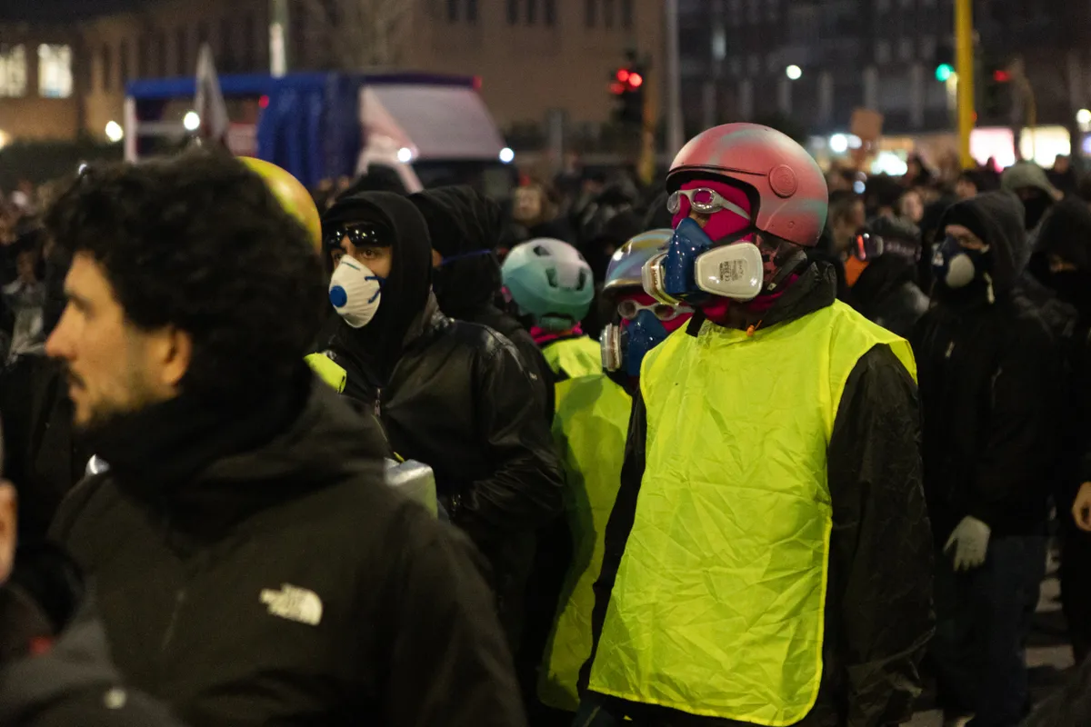 MILAN, ITALY – FEBRUARY 7: Thousands of demonstrators take part in an anti-Olympic protest against the Milano Cortina 2026 Winter Olympic Games, as they light smoke bombs and hang banners in in Milan, Italy, on February 7, 2026. Andrea Carrubba / Anadolu (Photo by Andrea Carrubba / Anadolu via AFP)