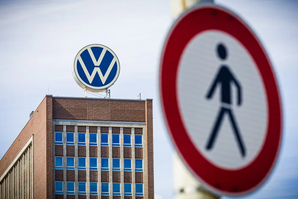04 July 2025, Lower Saxony, Wolfsburg: The logo on the roof of the VW brand tower can be seen behind a "no pedestrians" traffic sign. The VW Group is parting ways with Board Member for Human Resources Kilian with immediate effect. Photo: Moritz Frankenberg/dpa (Photo by Moritz Frankenberg / dpa Picture-Alliance via AFP)