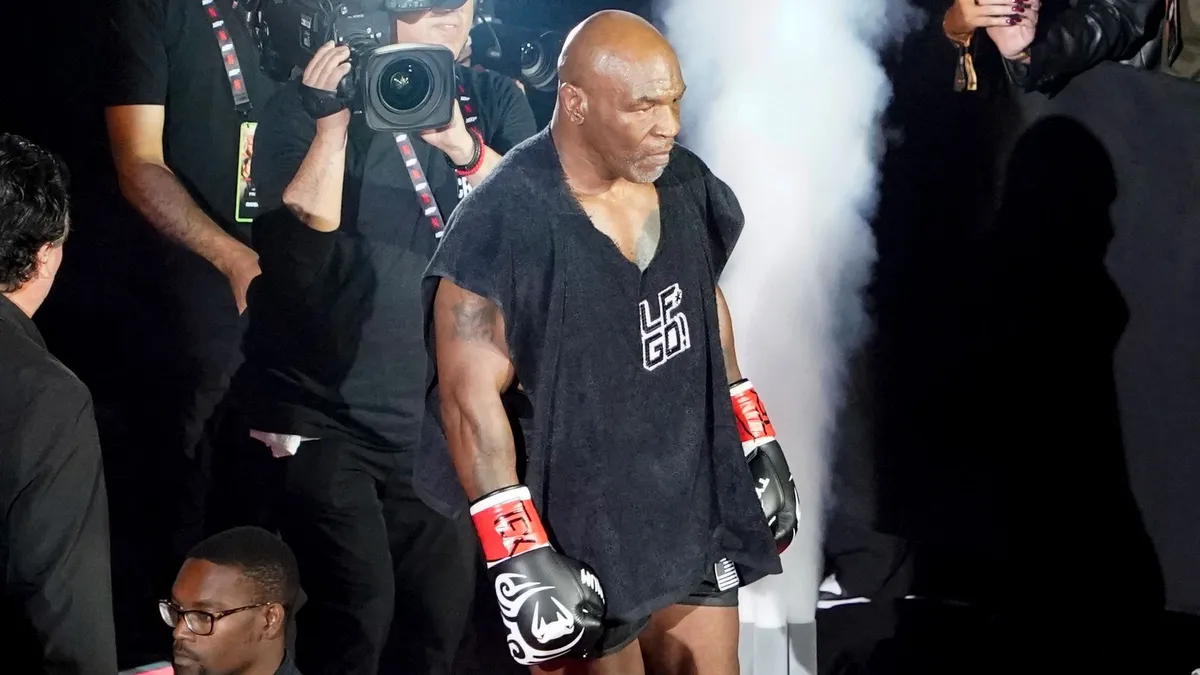 US retired pro-boxer Mike Tyson arrives to fight the heavyweight boxing bout against US YouTuber/boxer Jake Paul at The Pavilion at AT&T Stadium in Arlington, Texas, November 15, 2024. (Photo by TIMOTHY A. CLARY / AFP)