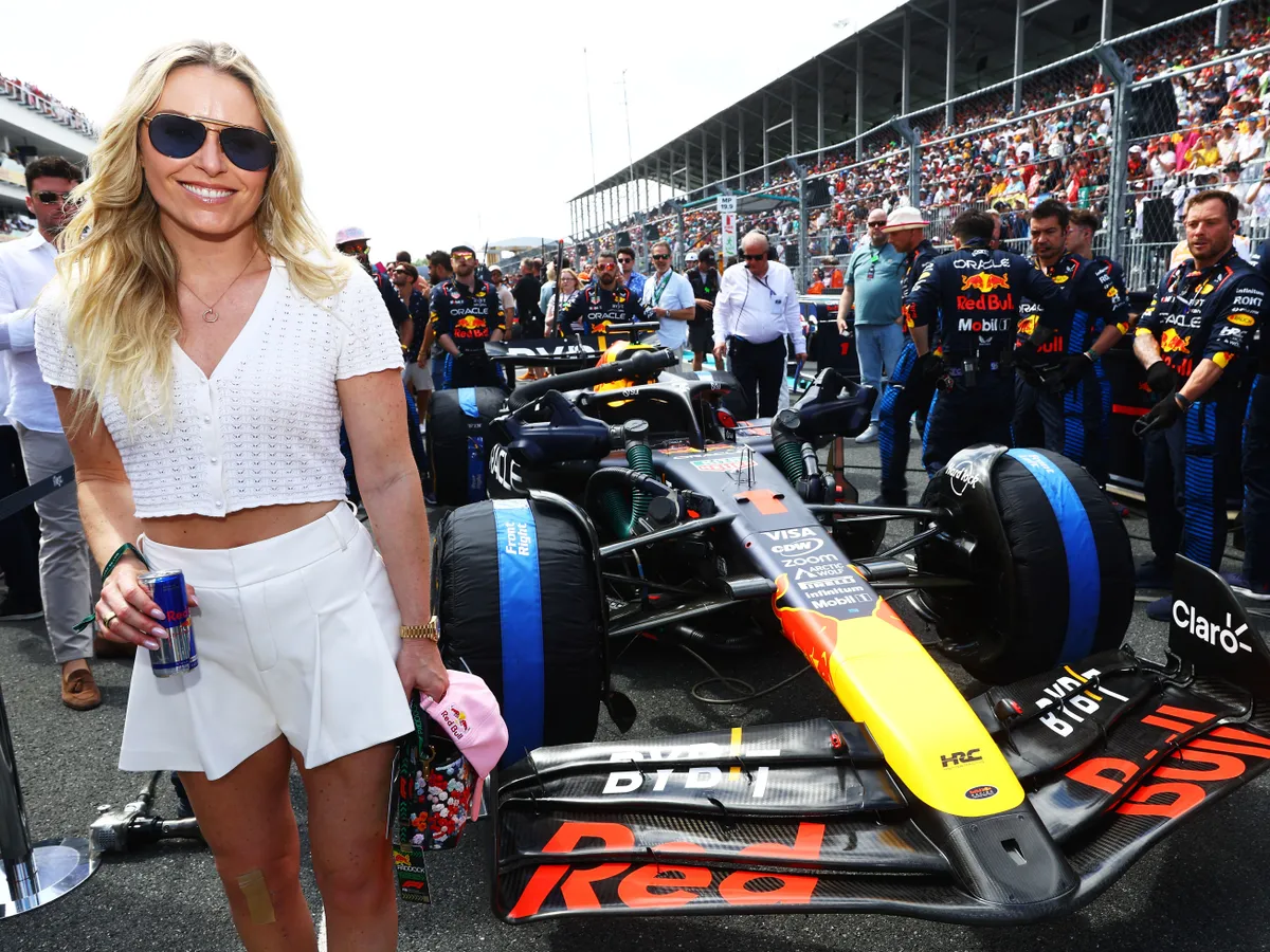 MIAMI, FLORIDA - MAY 05: Lindsey Vonn poses for a photo with Max Verstappen's Oracle Red Bull Racing RB20 on the grid prior to the F1 Grand Prix of Miami at Miami International Autodrome on May 05, 2024 in Miami, Florida.   Mark Thompson/Getty Images/AFP (Photo by Mark Thompson / GETTY IMAGES NORTH AMERICA / Getty Images via AFP)