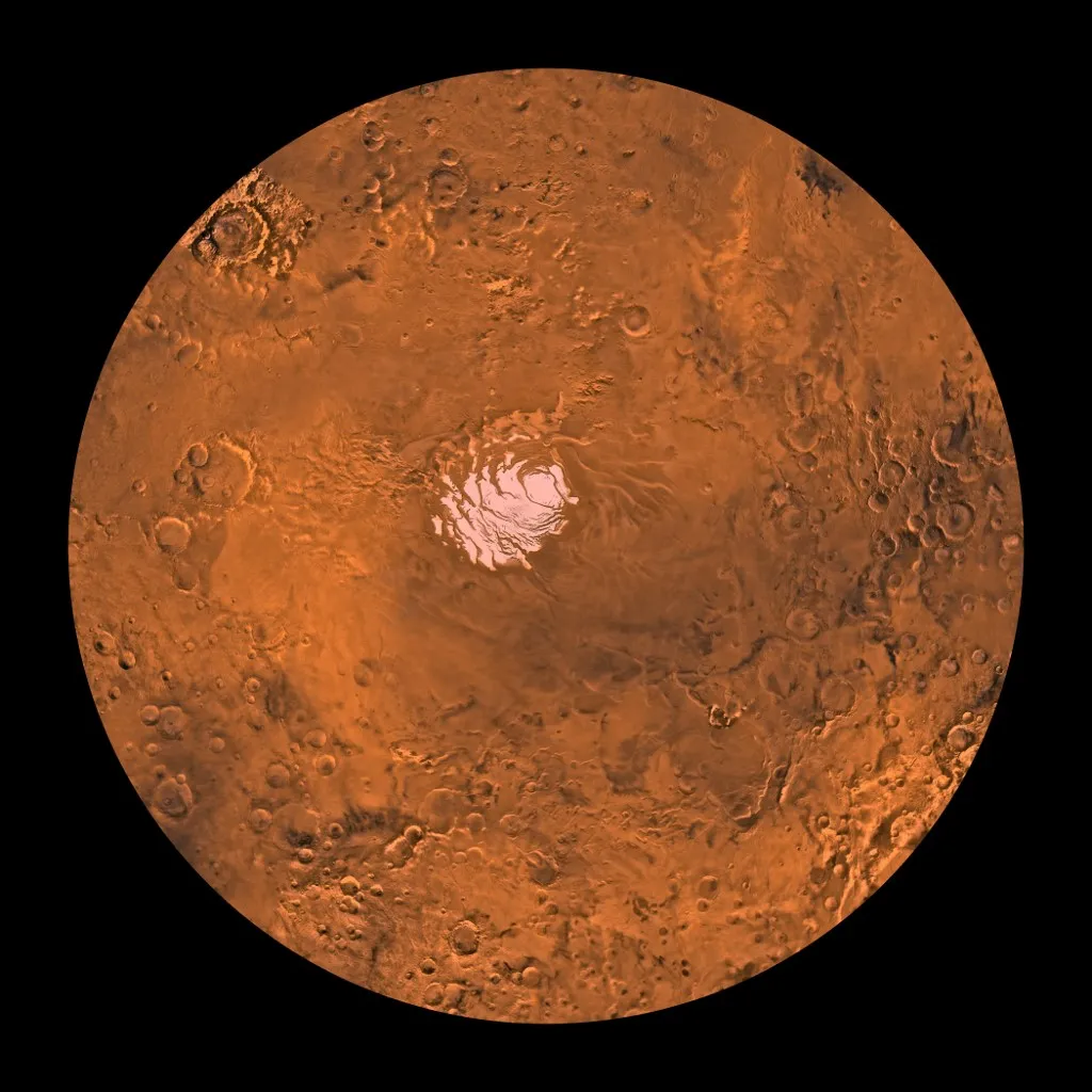 June 8, 1998 - Mars digital-image mosaic merged with color of the MC-30 quadrangle, Mare Australe region of Mars. The central part is dominated by a permanent residual ice cap that is enclosed by layered and troughed terrain. This cap is much smaller than the northern ice cap due to differing amounts of solar heating. The layered and troughed terrain is encircled by heavily and moderately cratered terrains that include unique depositional and erosional landforms, including large pits, troughs, and complex ridge systems. Latitude range -90 to -60 degrees, longitude range -180 to 180 degrees. (Photo by Stocktrek Images / NASA/JPL/USGS / StockTrek Images via AFP)