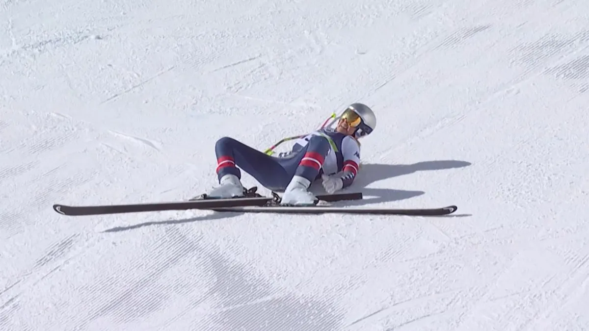 This handout video grab from IOC/OBS shows US Lindsey Vonn crashing during the women's downhill event at the Milano Cortina 2026 Winter Olympic Games in Cortina dAmpezzo on February 8, 2026. (Photo by Handout / various sources / AFP) / RESTRICTED TO EDITORIAL USE - MANDATORY CREDIT "AFP PHOTO / IOC-OBS " - HANDOUT - NO MARKETING NO ADVERTISING CAMPAIGNS - DISTRIBUTED AS A SERVICE TO CLIENTS
