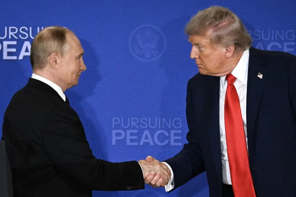 US President Donald Trump (R) and Russian President Vladimir Putin shake hands at the end of a joint press conference after participating in a US-Russia summit on Ukraine at Joint Base Elmendorf-Richardson in Anchorage, Alaska, on August 15, 2025. (Photo by Drew ANGERER / AFP)