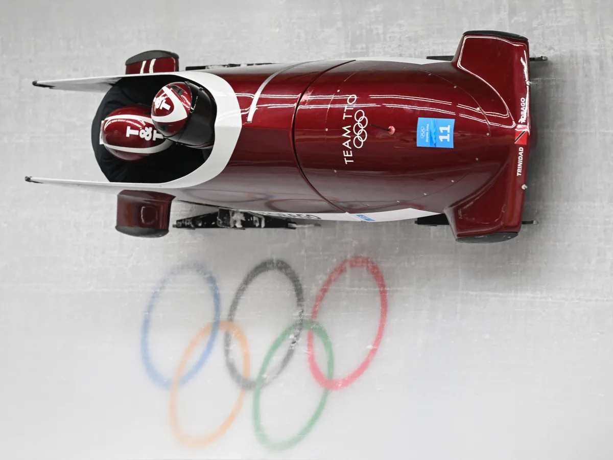 Trinidad and Tobago's Axel Brown takes part in the 2-man bobsleigh training at the Yanqing National Sliding Centre during the Beijing 2022 Winter Olympic Games in Yanqing on February 12, 2022. (Photo by Daniel MIHAILESCU / AFP)