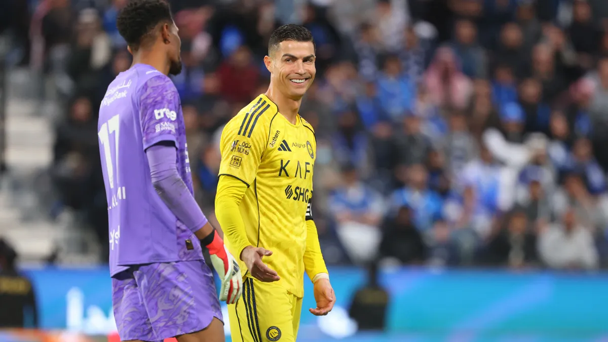Nassr's Portuguese forward #07 Cristiano Ronaldo reacts to Hilal's Saudi goalkeeper #17 Mohammed Al-Yami during the Saudi Pro League football match between Al-Hilal and Al-Nassr at Kingdom Arena stadium in Riyadh on January 12, 2026. (Photo by Fayez Nureldine / AFP)
