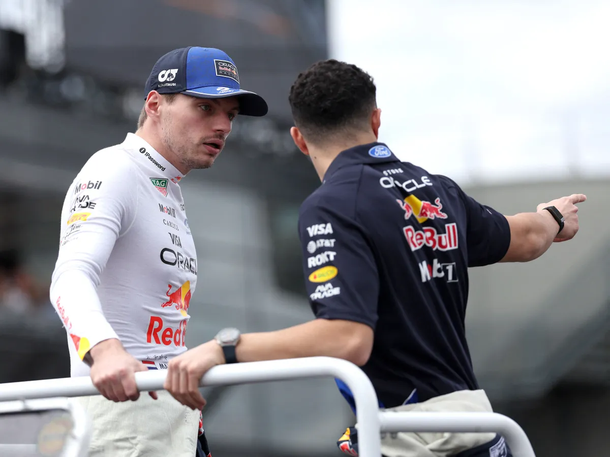 Red Bull Racing's Dutch driver Max Verstappen (L) and his teammate Isack Hadjar of France take part in the drivers' parade ahead of the Formula One Australian Grand Prix at Melbournes Albert Park Circuit on March 8, 2026. (Photo by Martin KEEP / AFP) / -- IMAGE RESTRICTED TO EDITORIAL USE - STRICTLY NO COMMERCIAL USE --
