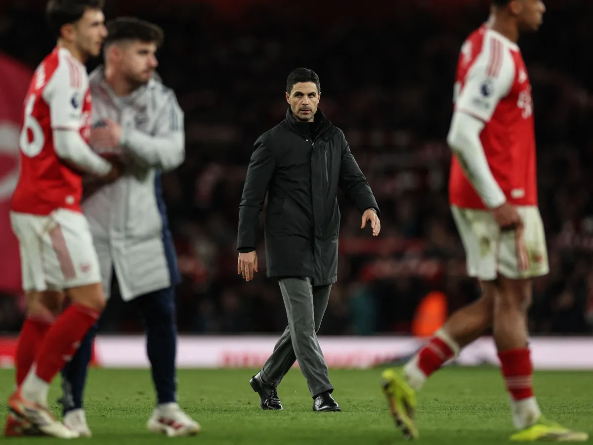 Arsenal's Spanish manager Mikel Arteta (C) leaves following his team's victory in the English Premier League football match between Arsenal and Chelsea at the Emirates Stadium in London on March 1, 2026. (Photo by Adrian Dennis / AFP) / RESTRICTED TO EDITORIAL USE. No use with unauthorized audio, video, data, fixture lists, club/league logos or 'live' services. Online in-match use limited to 120 images. An additional 40 images may be used in extra time. No video emulation. Social media in-match use limited to 120 images. An additional 40 images may be used in extra time. No use in betting publications, games or single club/league/player publications. / 
