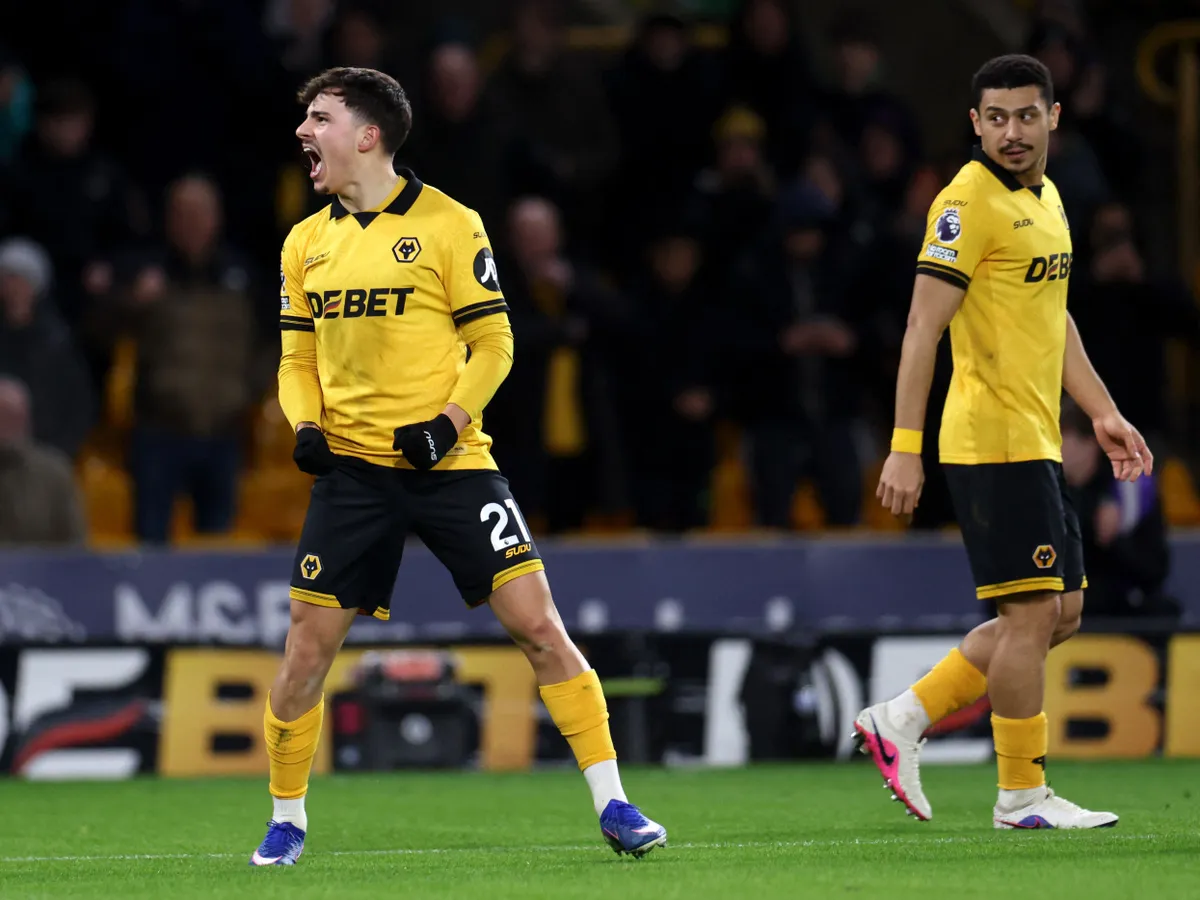 Wolverhampton Wanderers' Portugese midfielder #21 Rodrigo Gomes celebrates scoring the team's first goal during the English Premier League football match between Wolverhampton Wanderers and Liverpool at the Molineux stadium in Wolverhampton, central England on March 3, 2026. (Photo by Darren Staples / AFP) / RESTRICTED TO EDITORIAL USE. No use with unauthorized audio, video, data, fixture lists, club/league logos or 'live' services. Online in-match use limited to 120 images. An additional 40 images may be used in extra time. No video emulation. Social media in-match use limited to 120 images. An additional 40 images may be used in extra time. No use in betting publications, games or single club/league/player publications. /