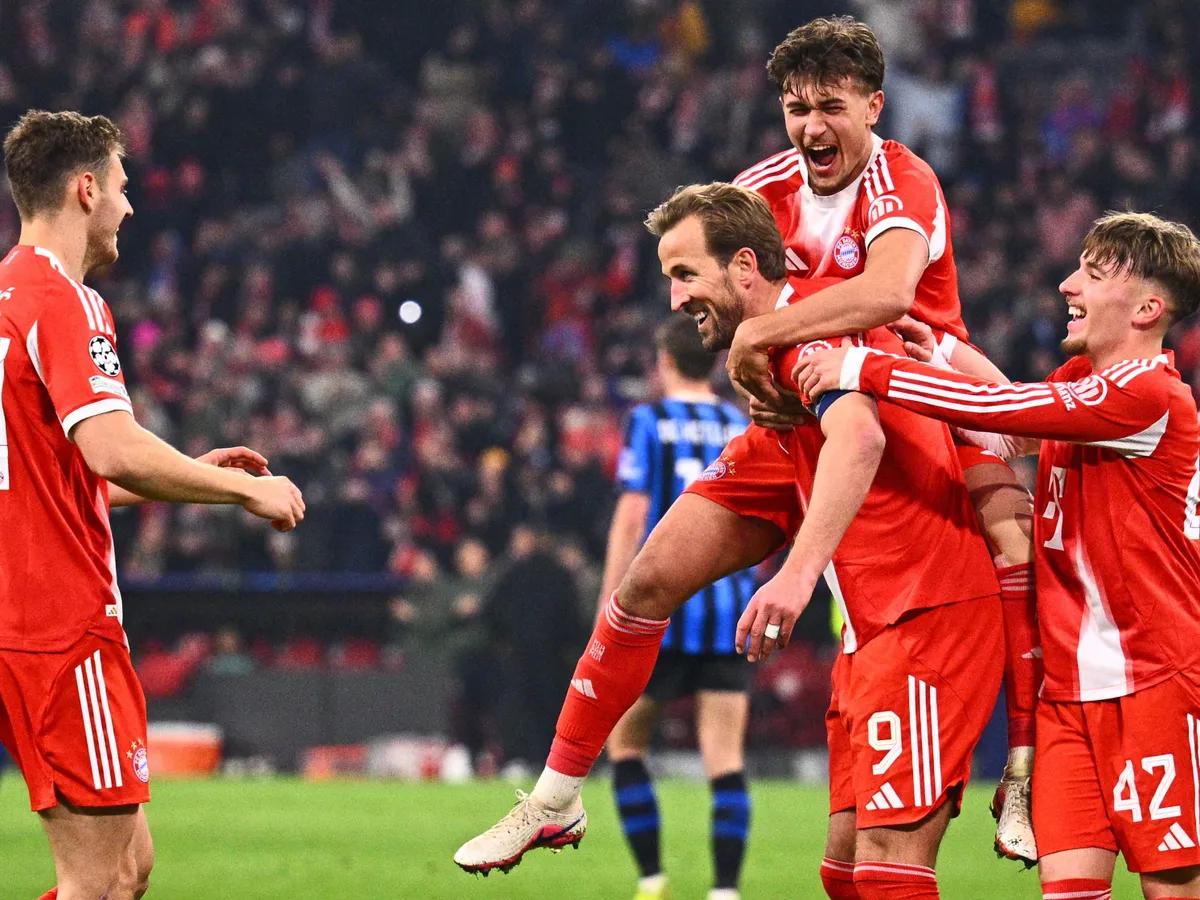 18 March 2026, Bavaria, Munich: Soccer, Men: Champions League, Bayern Munich - Atalanta Bergamo, knockout round, round of 16, second leg, Allianz Arena. The players around the scorer of the 2:0 goal, Harry Kane (Bayern Munich), cheer. Photo: Tom Weller/dpa (Photo by Tom Weller / dpa Picture-Alliance via AFP)