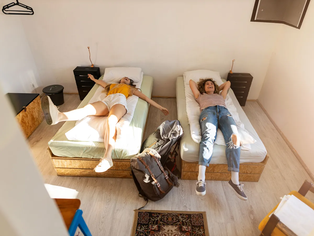 Young female tourists staying in youth hostel