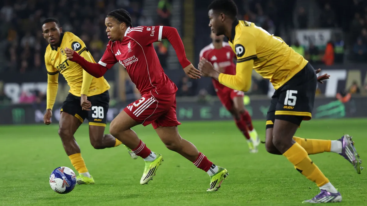 Liverpool's English striker #73 Rio Ngumoha runs through the Liverpool defence during the English FA Cup fifth round football match between Wolverhampton Wanderers and Liverpool at the Molineux stadium in Wolverhampton, central England on March 6, 2026. (Photo by Darren Staples / AFP) / RESTRICTED TO EDITORIAL USE. No use with unauthorized audio, video, data, fixture lists, club/league logos or 'live' services. Online in-match use limited to 120 images. An additional 40 images may be used in extra time. No video emulation. Social media in-match use limited to 120 images. An additional 40 images may be used in extra time. No use in betting publications, games or single club/league/player publications. /