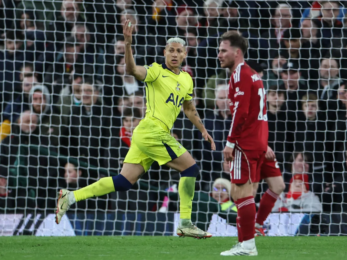 Tottenham Hotspur's Brazilian striker #09 Richarlison (L) celebrates after scoring his team's first goal to equalise, during the English Premier League football match between Liverpool and Tottenham Hotspur at Anfield in Liverpool, north west England on March 15, 2026. (Photo by Darren Staples / AFP) / RESTRICTED TO EDITORIAL USE. No use with unauthorized audio, video, data, fixture lists, club/league logos or 'live' services. Online in-match use limited to 120 images. An additional 40 images may be used in extra time. No video emulation. Social media in-match use limited to 120 images. An additional 40 images may be used in extra time. No use in betting publications, games or single club/league/player publications. / 