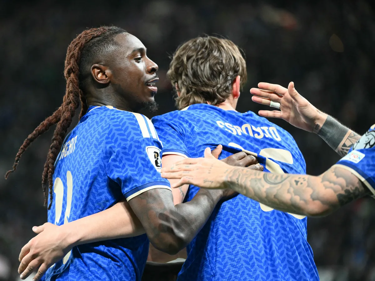 Italy's forward #11 Moise Kean (L) celebrates with teammates scoring his team's second goal during the play-off FIFA World Cup 2026 European qualification semi-final football match between Italy and North Ireland at the Gewiss stadium in Bergamo, on March 26, 2026. (Photo by Alberto PIZZOLI / AFP)