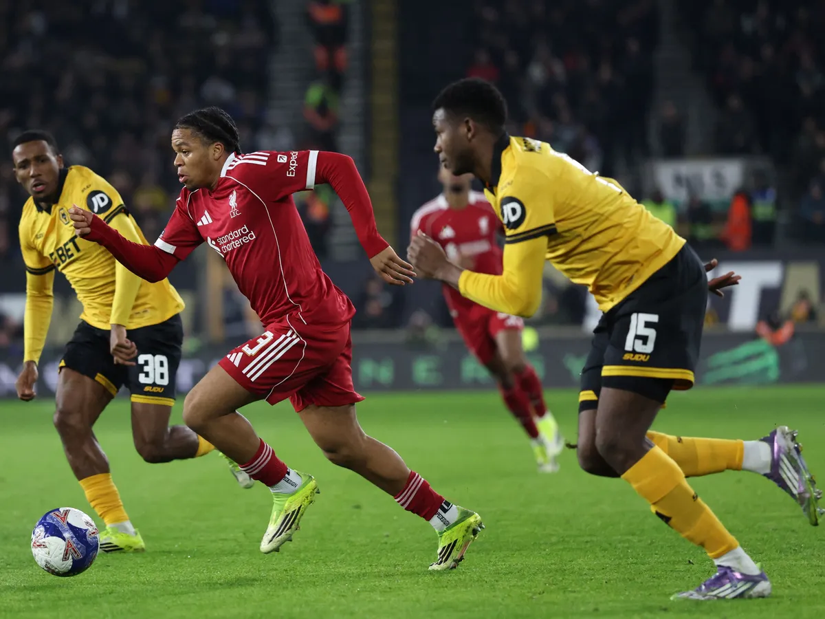 Liverpool's English striker #73 Rio Ngumoha runs through the Liverpool defence during the English FA Cup fifth round football match between Wolverhampton Wanderers and Liverpool at the Molineux stadium in Wolverhampton, central England on March 6, 2026. (Photo by Darren Staples / AFP) / RESTRICTED TO EDITORIAL USE. No use with unauthorized audio, video, data, fixture lists, club/league logos or 'live' services. Online in-match use limited to 120 images. An additional 40 images may be used in extra time. No video emulation. Social media in-match use limited to 120 images. An additional 40 images may be used in extra time. No use in betting publications, games or single club/league/player publications. / 