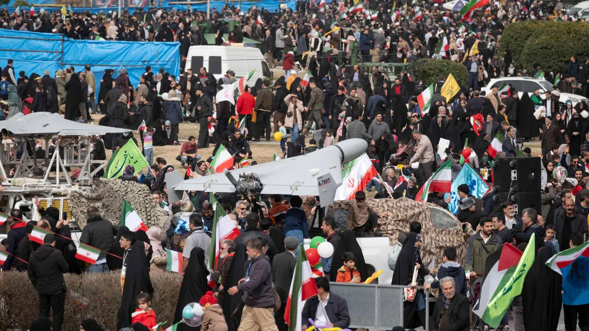 An Iran-made unmanned aerial vehicle (UAV), the Shahed-136, is displayed in a rally commemorating the 47th anniversary of the Islamic Revolution's victory in Azadi (Freedom) Square in western Tehran, Iran, on February 11, 2026. (Photo by Morteza Nikoubazl/NurPhoto) (Photo by Morteza Nikoubazl / NurPhoto via AFP)