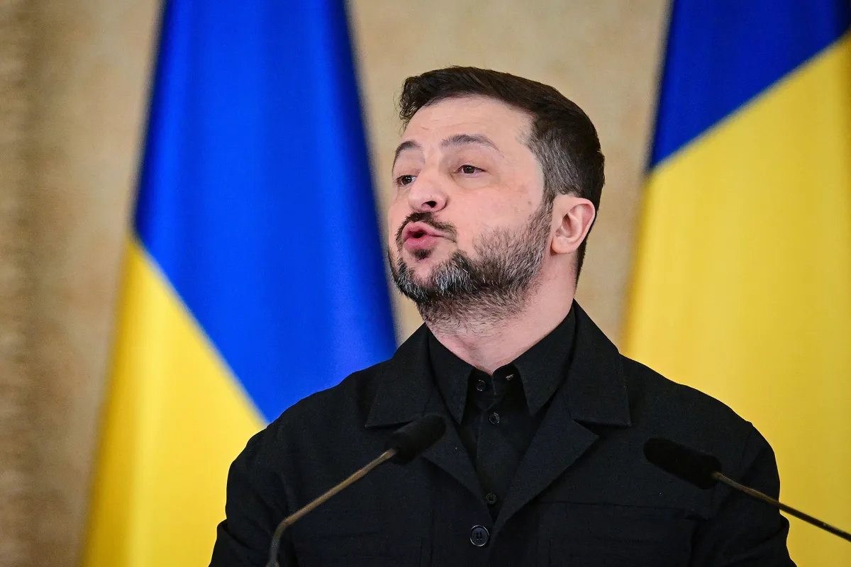 Ukrainian President Volodymyr Zelensky addresses a joint press conference with his Romanian counterpart at Cotroceni Palace, the official residence of the Romanian president, in Bucharest on March 12, 2026. Ukrainian President Zelensky arrived on March 12 in Romania, where he was to visit an F-16 fighter jet training centre and meet Romania's leader, before visiting France later this week. The visits come at a time of uncertainty over planned peace talks between Kyiv and Moscow that have been spearheaded by the United States and derailed by the US-Israeli war with Iran. (Photo by Daniel MIHAILESCU / AFP)