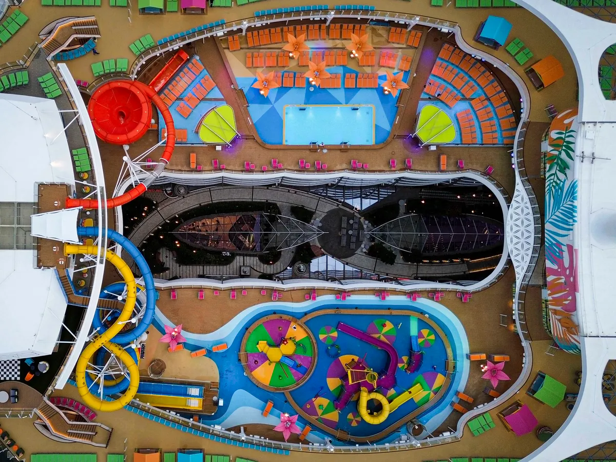 This aerial picture taken on July  11, 2024 shows Royal Caribbean's "Utopia Of The Seas," billed as the world's largest cruise ship, docked at Port Canaveral in Cape Canaveral, Florida. (Photo by Miguel J. Rodriguez Carrillo / AFP)