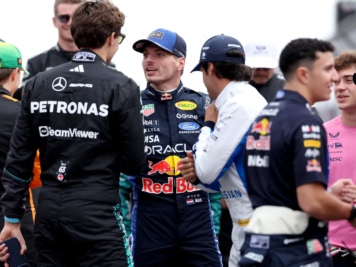 Red Bull Racings Dutch driver Max Verstappen (C) arrives for a group photo ahead of the Formula One Australian Grand Prix at Melbournes Albert Park Circuit on March 8, 2026. (Photo by Martin KEEP / AFP) / -- IMAGE RESTRICTED TO EDITORIAL USE - STRICTLY NO COMMERCIAL USE --