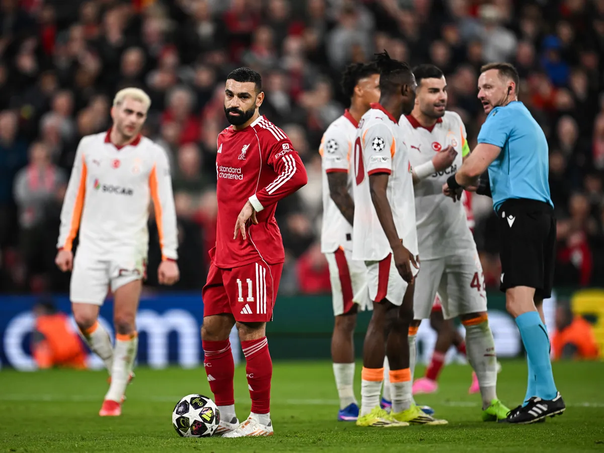 Liverpool's Egyptian forward #11 Mohamed Salah (C) prepares for penalty during the UEFA Champions League, round of 16 second leg football match between Liverpool and Galatasaray at Anfield in Liverpool, north-west England on March 18, 2026. (Photo by Paul ELLIS / AFP)