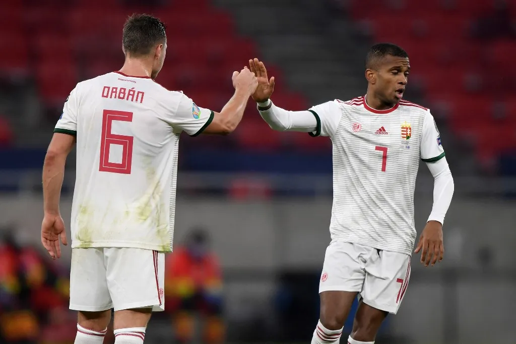 Hungary's defender Loïc Nego (R) celebrates after scoring a goal with Hungary's defender Willi Orban during the UEFA European Qualifiers play-off final football match between Hungary and Iceland at the Puskas Arena in Budapest on November 12, 2020. (Photo by Attila KISBENEDEK / AFP)