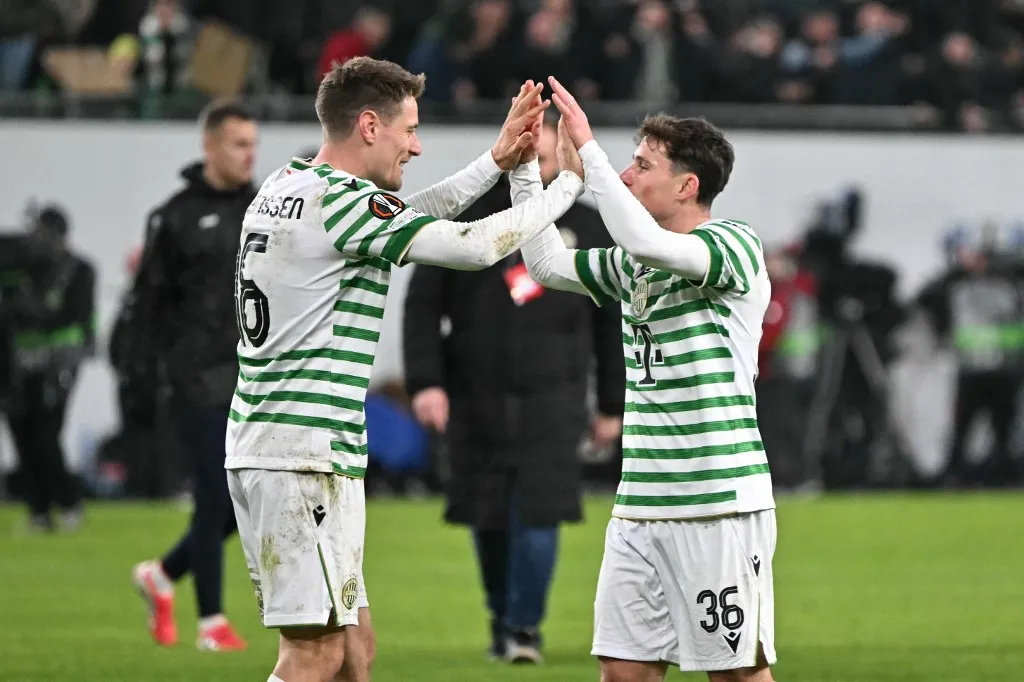 Ferencváros Norwegian midfielder #16 (L) and Ferencvaros' Israeli midfielder #36 Gavriel Kanichowsky Kristoffer Zachariassen celebrate after winning the UEFA Europa League knockout round playoff second leg football match Ferencvaros v Ludogorets Razgrad in Budapest, Hungary, on February 26, 2026. (Photo by Attila KISBENEDEK / AFP)
