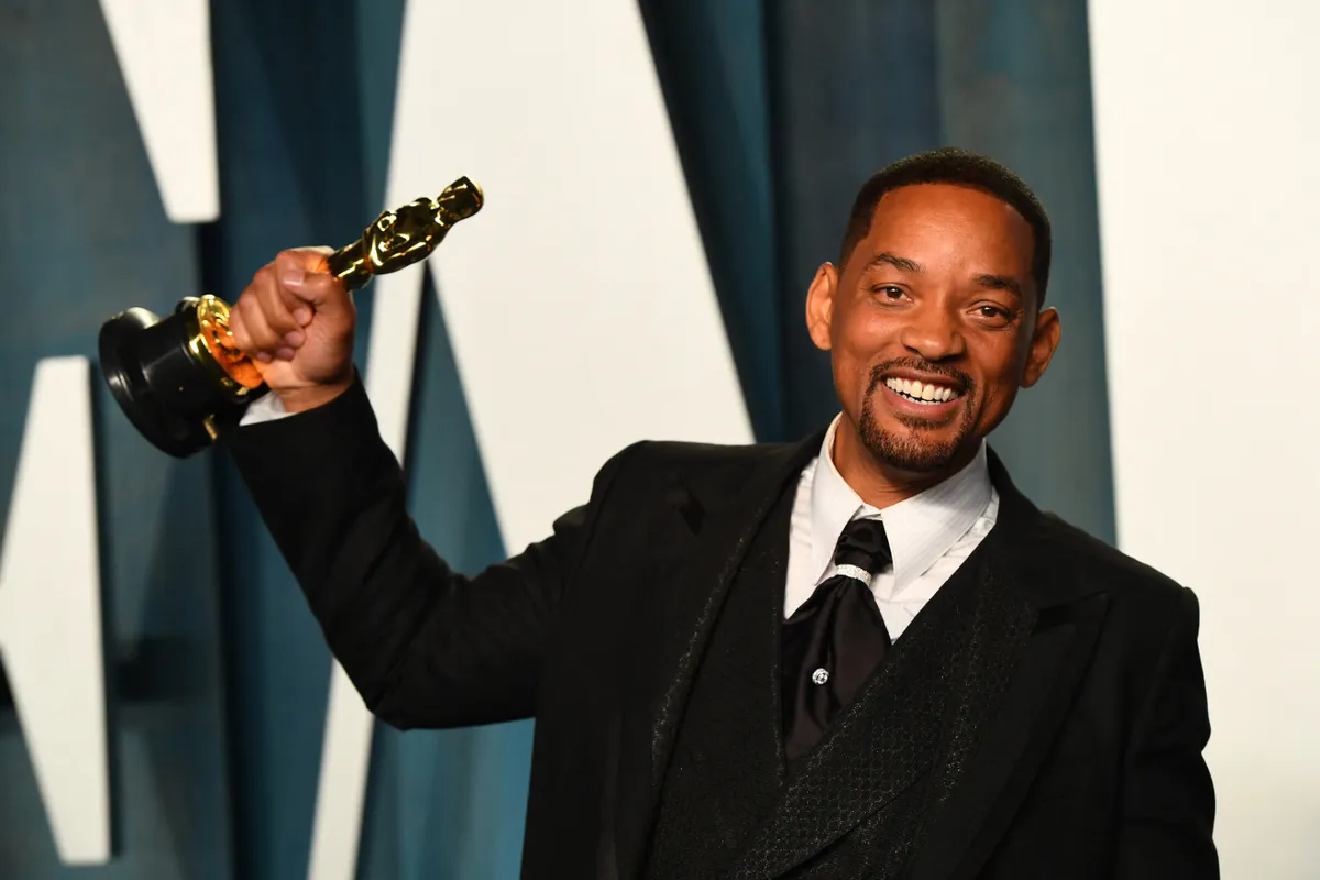 US actor Will Smith holds his award for Best Actor in a Leading Role for "King Richard" as he attends the 2022 Vanity Fair Oscar Party following the 94th Oscars at the The Wallis Annenberg Center for the Performing Arts in Beverly Hills, California on March 27, 2022. (Photo by Patrick T. FALLON / AFP)