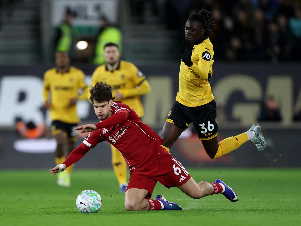 Wolverhampton Wanderers' Portuguese-born English striker #36 Mateus Mane fouls Liverpool's Hungarian defender #06 Milos Kerkez during the English Premier League football match between Wolverhampton Wanderers and Liverpool at the Molineux stadium in Wolverhampton, central England on March 3, 2026. (Photo by Darren Staples / AFP) / RESTRICTED TO EDITORIAL USE. No use with unauthorized audio, video, data, fixture lists, club/league logos or 'live' services. Online in-match use limited to 120 images. An additional 40 images may be used in extra time. No video emulation. Social media in-match use limited to 120 images. An additional 40 images may be used in extra time. No use in betting publications, games or single club/league/player publications. /
