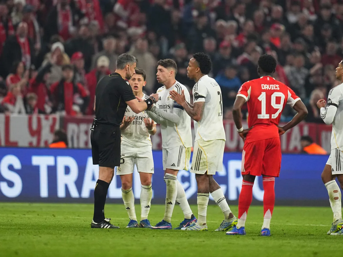 Arda Guler (Real Madrid) and Slavko Vincic (Slovenia) gestures during UEFA Champions league Quarter Final UEFA Champions League: Bayern Munich and Real Madrid at Allianz Arena, Munich, Germany on April 15  2026. (Photo by Ulrik Pedersen/NurPhoto) (Photo by Ulrik Pedersen / NurPhoto via AFP)