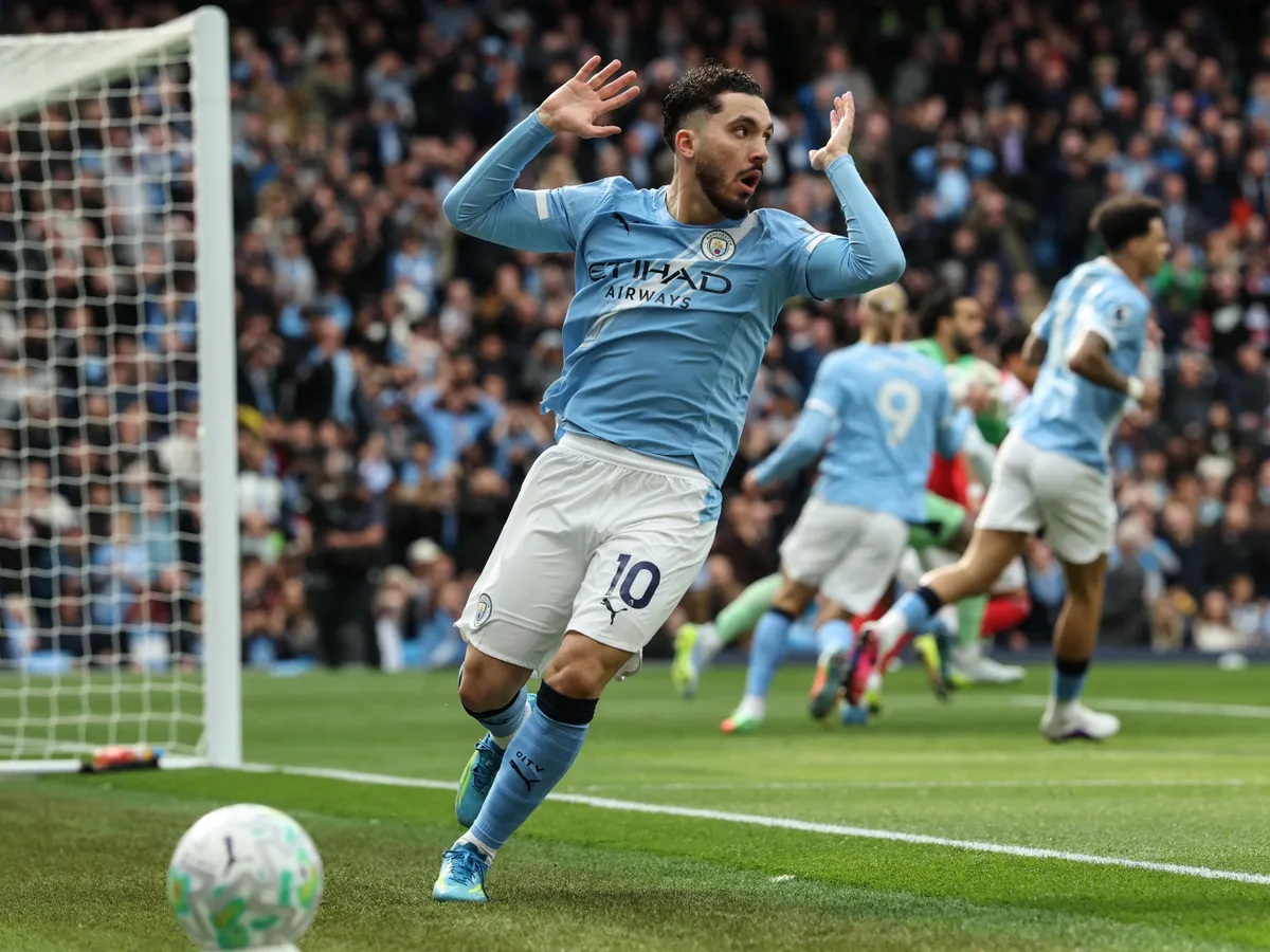 Manchester City's French midfielder #10 Rayan Cherki reacts after a missed chance during the English Premier League football match between Manchester City and Arsenal at the Etihad Stadium in Manchester, north west England, on April 19, 2026. (Photo by Darren Staples / AFP) / RESTRICTED TO EDITORIAL USE. No use with unauthorized audio, video, data, fixture lists, club/league logos or 'live' services. Online in-match use limited to 120 images. An additional 40 images may be used in extra time. No video emulation. Social media in-match use limited to 120 images. An additional 40 images may be used in extra time. No use in betting publications, games or single club/league/player publications. /