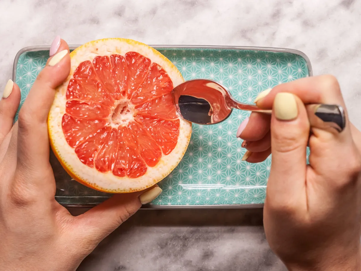 red grapefruit rectangular plate and spoon