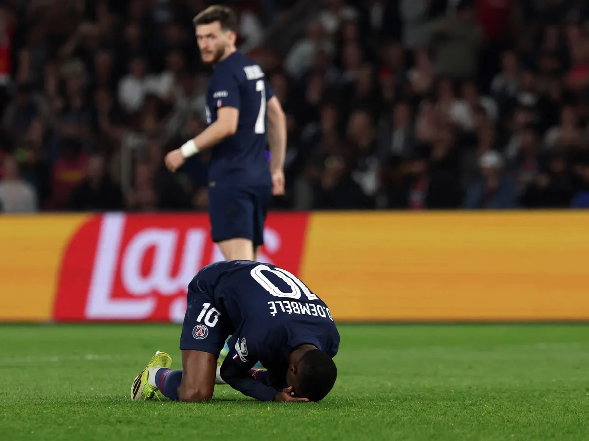 Paris Saint-Germain's French forward #10 Ousmane Dembele reacts after missing a goal opportunity during the UEFA Champions League quarter-final first leg football match between Paris Saint-Germain (PSG) and Liverpool FC at the Parc des Princes stadium in Paris on April 8, 2026. (Photo by Anne-Christine POUJOULAT / AFP)