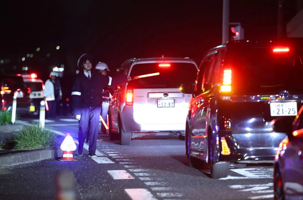 A photo shows the road toward the coast was closed by police after the Off the Coast of Hokkaido and Sanriku Subsequent Earthquake Advisory that struck off the coast of Iwate Prefecture, Japan, on April 20, 2026. Around 4:53 pm on that day, an earthquake with its epicenter off the coast of Sanriku occurred. According to them, the epicenter was estimated to be about 19 km deep, and the earthquake's magnitude was 7.7 on the Richter scale. The quake registered a seismic intensity of 5+ in Sanpachikamikita, Aomori Prefecture, and 5- in the northern coast, Iwate Prefecture. Tsunami warnings have been issued for the Pacific coast of Hokkaido and Iwate Prefecture. ( The Yomiuri Shimbun ) (Photo by YOMIURI SHIMBUN / The Yomiuri Shimbun via AFP)