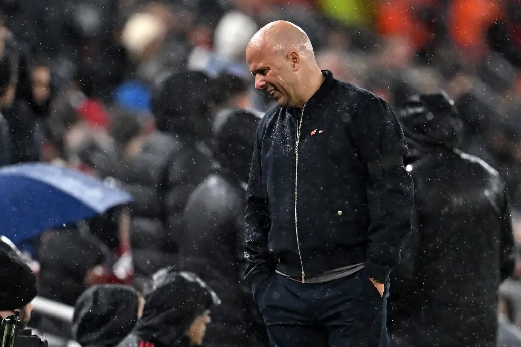 Liverpool's Dutch manager Arne Slot reacts after conceding the teams first goal during the UEFA Champions League quarter final, second-leg football match between Liverpool and Paris Saint-Germain at Anfield in Liverpool, north west England on April 14, 2026. (Photo by Paul ELLIS / AFP)