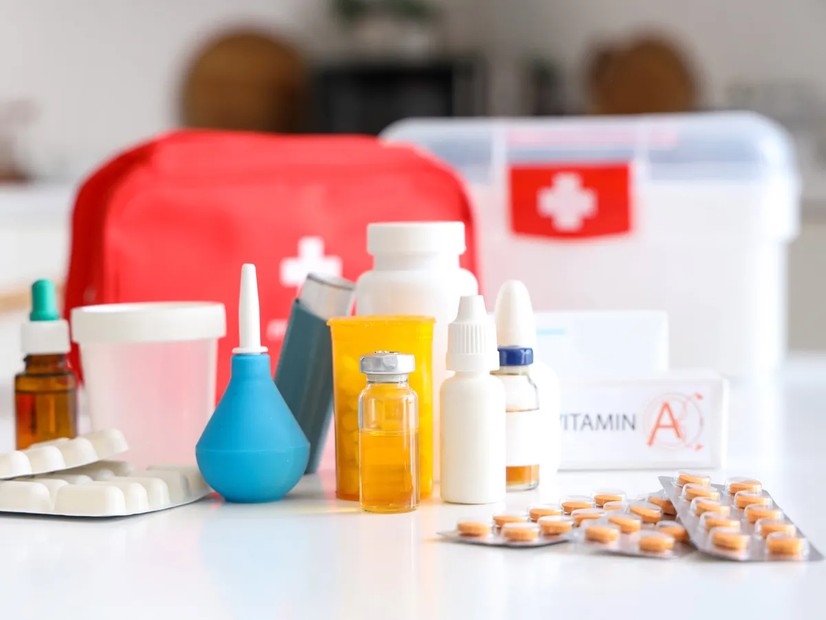 First aid supplies on table in kitchen, closeup